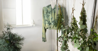 Upcycled hoodie naturally dyed with organic plant materials.